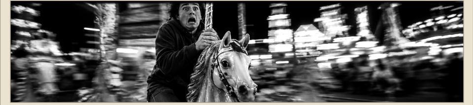 Terrified rider on a merry-go-round